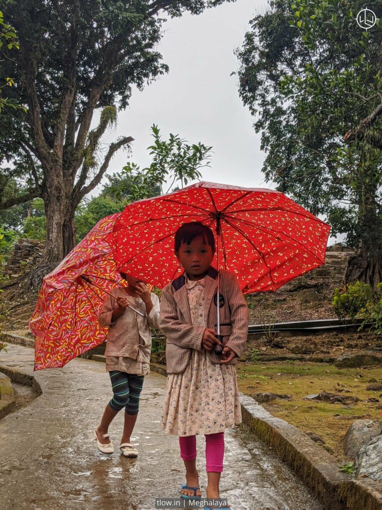 Children carrying umbrella in Meghalaya
