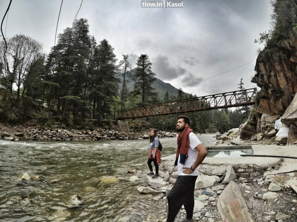 college students chilling at Kasol riverside