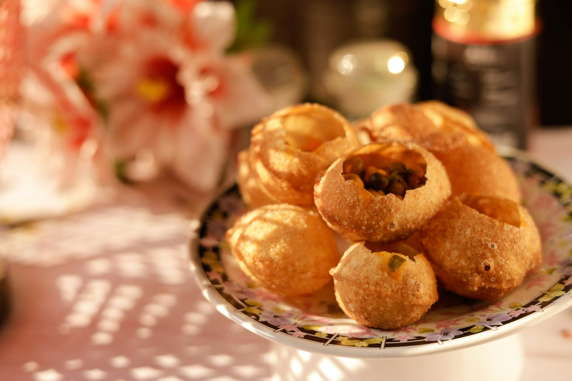 a close up shot of a plate of delicious panipuri