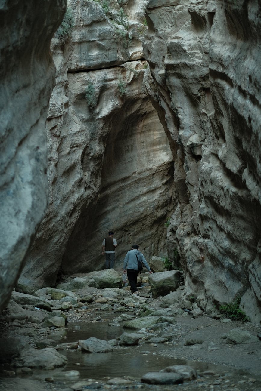 hiker in rocky cave