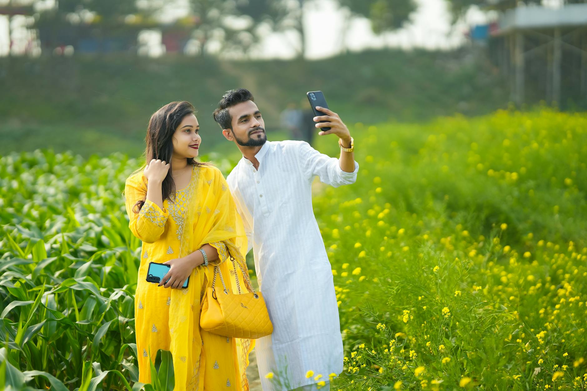 couple taking a picture on a field in india